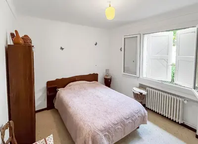a bedroom with a bed and a window at Les Terrasses de l'Adrech in Banon