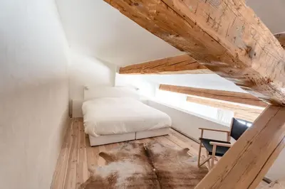 a bedroom with a bed and a desk and a chair at La Bergerie Ferme du Montaiguet in Aix-en-Provence