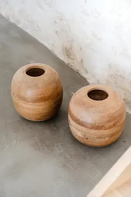 two wooden vases sitting on top of a floor at La Bergerie Ferme du Montaiguet in Aix-en-Provence