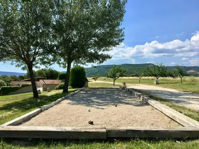 a sand trap with two trees in a field at Provençal Villa With Luberon Views in Céreste