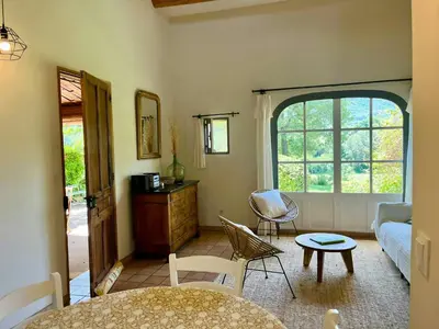 a living room with a couch and a table at Provençal Villa With Luberon Views in Céreste