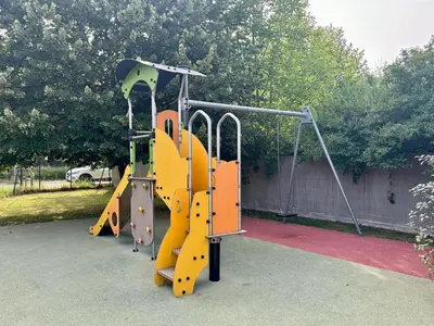 a playground with a yellow and orange slide at Douceur de vivre en Provence in Saint-Saturnin-lès-Avignon