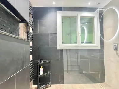 a bathroom with a shower and a window at Casa Corniou - Calme, Village Provençal, 3 chambres, 2 SDB, 8 personnes in Cornillon-Confoux
