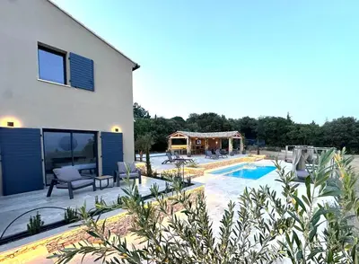 a house with a swimming pool next to a house at Keur Bouyo - Provençal Luxury Retreat in Saint-Saturnin-les-Apt