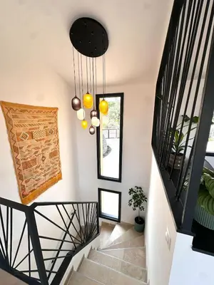 a staircase in a home with black and white at Keur Bouyo - Provençal Luxury Retreat in Saint-Saturnin-les-Apt