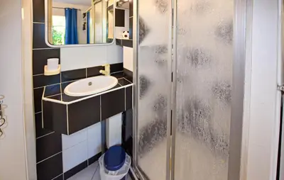 a bathroom with a shower with a sink and a mirror at Stunning Home In Morières-Lès-Avignon in Morières-lès-Avignon