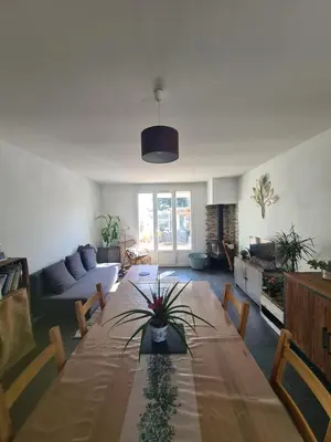 a living room with a table and a couch at Villa avec piscine en Provence in Pernes-les-Fontaines