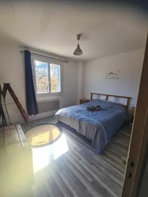 a bedroom with a bed and a window at Villa avec piscine en Provence in Pernes-les-Fontaines