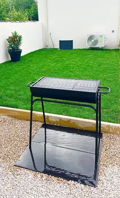 a ping pong table sitting in a yard at Le Cabanon Meublé de Tourisme trois étoiles in Entraigues-sur-la-Sorgue