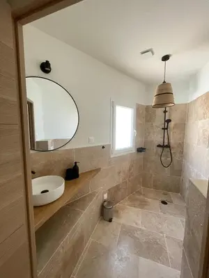 a bathroom with a sink and a mirror at le petit 105 villa neuve avec piscine in La Fare-les-Oliviers