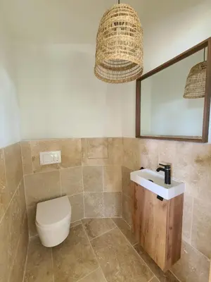 a bathroom with a toilet and a sink at le petit 105 villa neuve avec piscine in La Fare-les-Oliviers