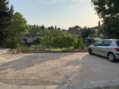 a silver car parked in a driveway at Studio terrasse in Aix-en-Provence