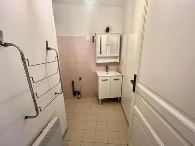 a small bathroom with a sink and a mirror at Salon de Provence in Salon-de-Provence