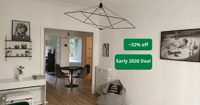 a living room with a table and a dining room at 2 bedroom apartment in the city center in Aix-en-Provence