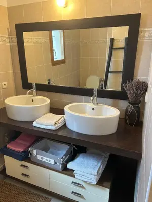 a bathroom with two sinks and a large mirror at beautiful 4 bedroom villa, pool, Luberon in Cadenet