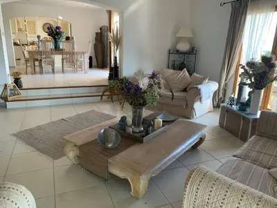 a living room with a couch and a table at beautiful 4 bedroom villa, pool, Luberon in Cadenet