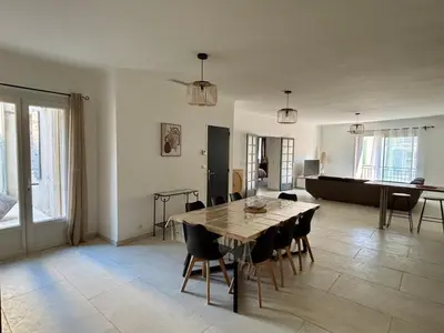 a large living room with a table and chairs at Appartement 100 m carré pour 6 à 8 personnes in Saint-Cannat