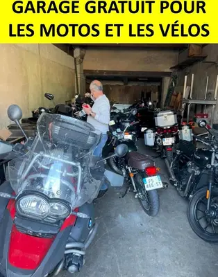 a man standing next to a group of motorcycles at Hotel D'Albion in Sault-de-Vaucluse