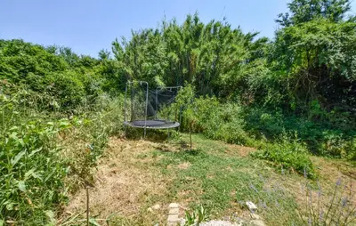 a metal object in the middle of a field at Maison Avec Jacuzzi in Mazan