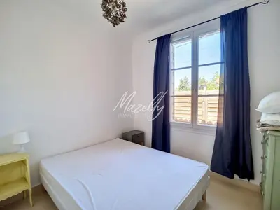 a bedroom with a bed and a window at La Villa Luberonnaise in Robion en Luberon