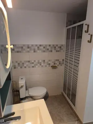 a bathroom with a toilet and a sink at Maison au coeur de Banon in Banon
