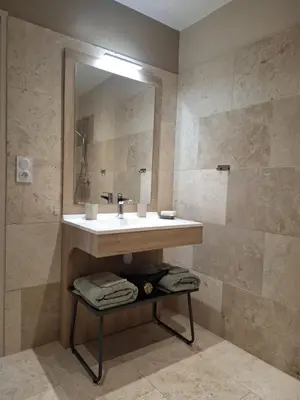 a bathroom with a sink and a mirror at logement indépendant avec terrasse privative dans les Alpilles in Aureille