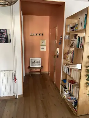 a hallway with a room with bookshelves at Quiet cozy apartment in Aix-en-Provence