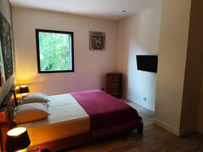 a bedroom with a bed and a window at Aloha in Aix-en-Provence