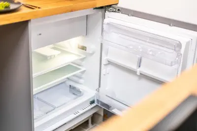 an open refrigerator with its door open at Studio cosy I Centre historique in Cavaillon