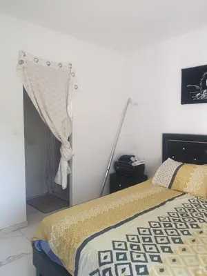 a bedroom with a bed with a curtain on it at Villa in Carpentras