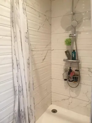 a bathroom with a shower with a shower curtain at Villa in Carpentras