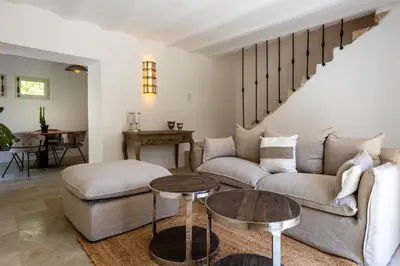 a living room with a couch and a table at Gîte Terrasse in Gordes