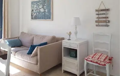 a living room with a couch and a table at Maison Avec Jacuzzi in Mazan