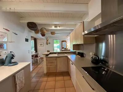 a kitchen with a sink and a stove top oven at La Maison du Petit Hérisson de 170 m2 avec jardin parking accueil de 6 personnes barbecue in Aix-en-Provence