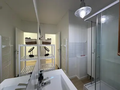 a bathroom with a sink and a shower at L'étape Aixoise - appartement climatisé terrasse centre ville Rotonde cours Mirabeau allées provençales in Aix-en-Provence