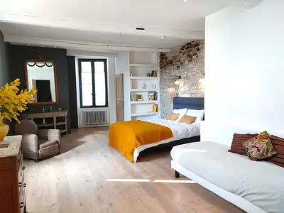 a bedroom with two beds and a yellow blanket at Charming house in Provence, 2 to 10 people in Saignon
