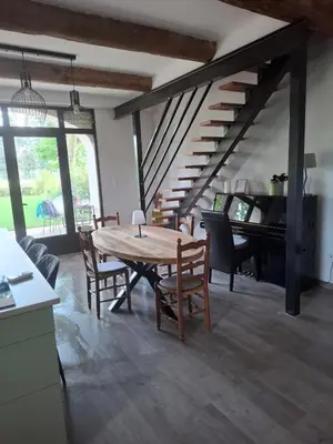 a dining room with a table and a piano at Gîte dans un mas Provençal - L'Oustalet in Saint-Andiol