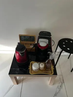 a table with a blender and other appliances on it at Chambre d'hôtes in Carpentras