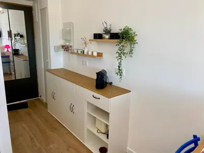 a kitchen with white cabinets and a counter at Ma place au sud 216 in Éguilles