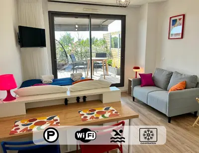 a living room with a couch and a table at Ma place au sud 216 in Éguilles