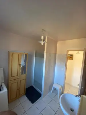 a bathroom with a tub and a sink and a toilet at Villa de l'Argau in Revest-du-Bion