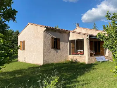 an old house in a field with a grass yard at Villa de l'Argau in Revest-du-Bion