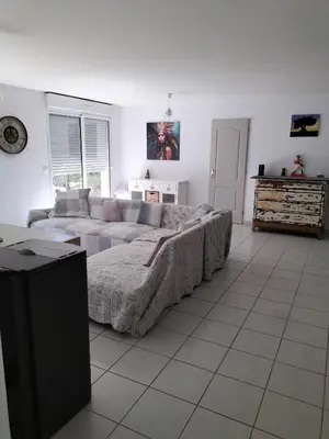 a living room with a large bed and a couch at L infiniment zen in Caromb