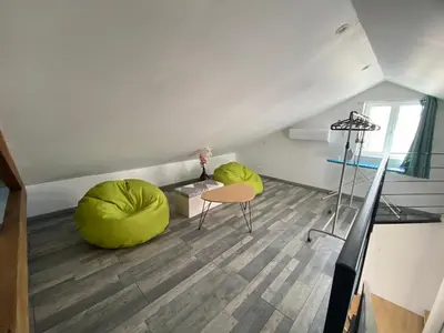a room with two bean bag chairs and a table at Les Tilleuls in Bonnieux