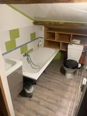 a small bathroom with a toilet and a sink at Les terrasses des pourquiers in Gordes
