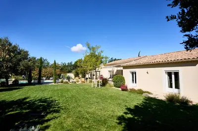 a house with a yard with green grass at Maison au calme proche Mont Ventoux et Luberon in Malemort-du-Comtat