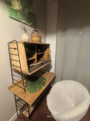 a room with a wooden shelf and a stool at Gîte en Provence in Cavaillon
