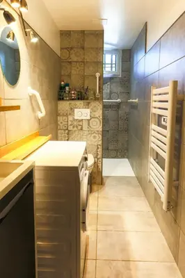 a bathroom with a sink and a shower at Le Gran Cabano sous les oliviers in Saint-Rémy-de-Provence