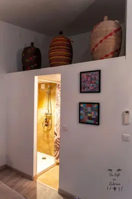a room with three large vases on the wall at Un Loft en Luberon à Bonnieux in Bonnieux