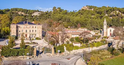 an aerial view of a town with a building at Le Yodala - Lamanon in Lamanon